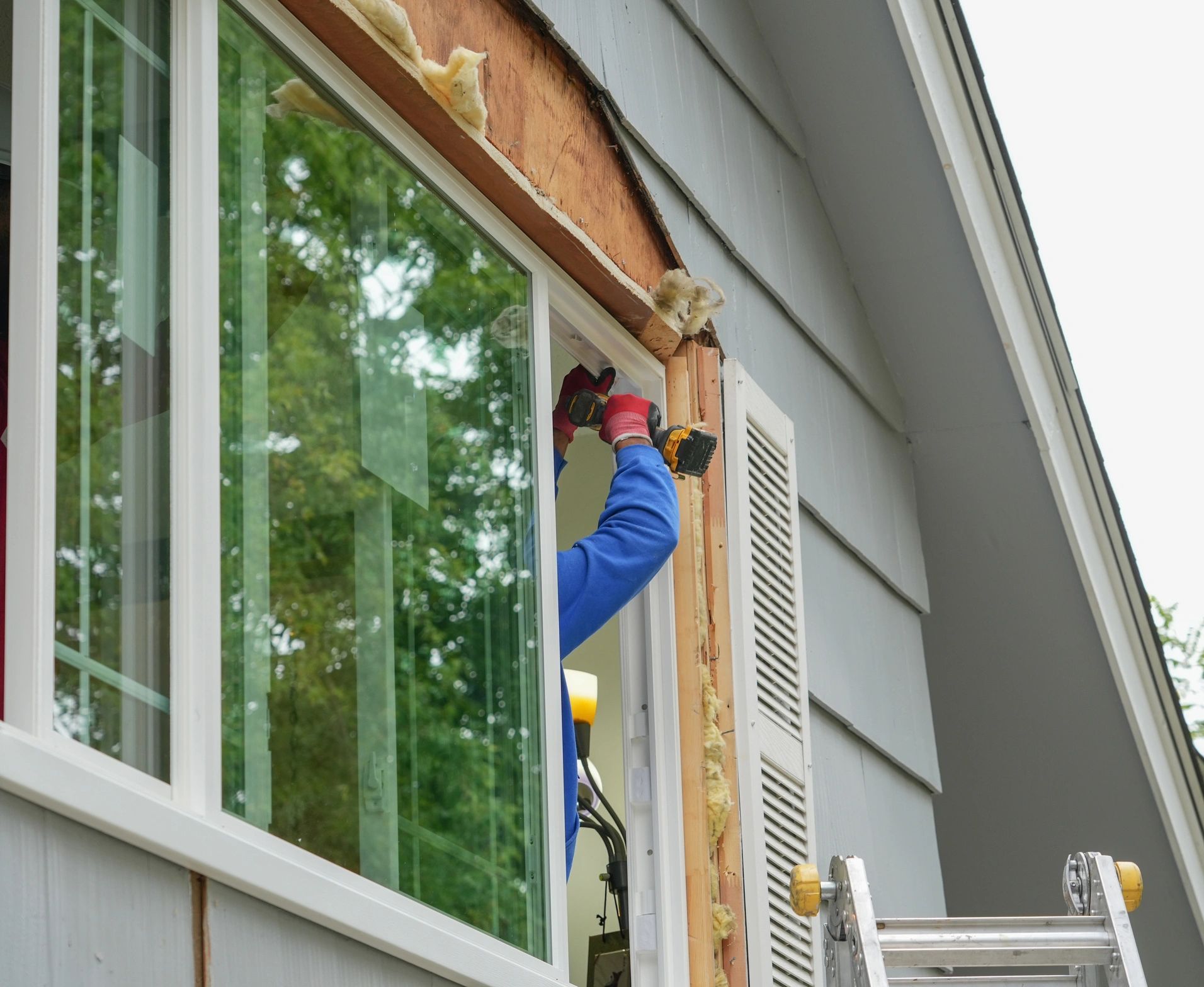 Handyman fixing a door in a Burke County home